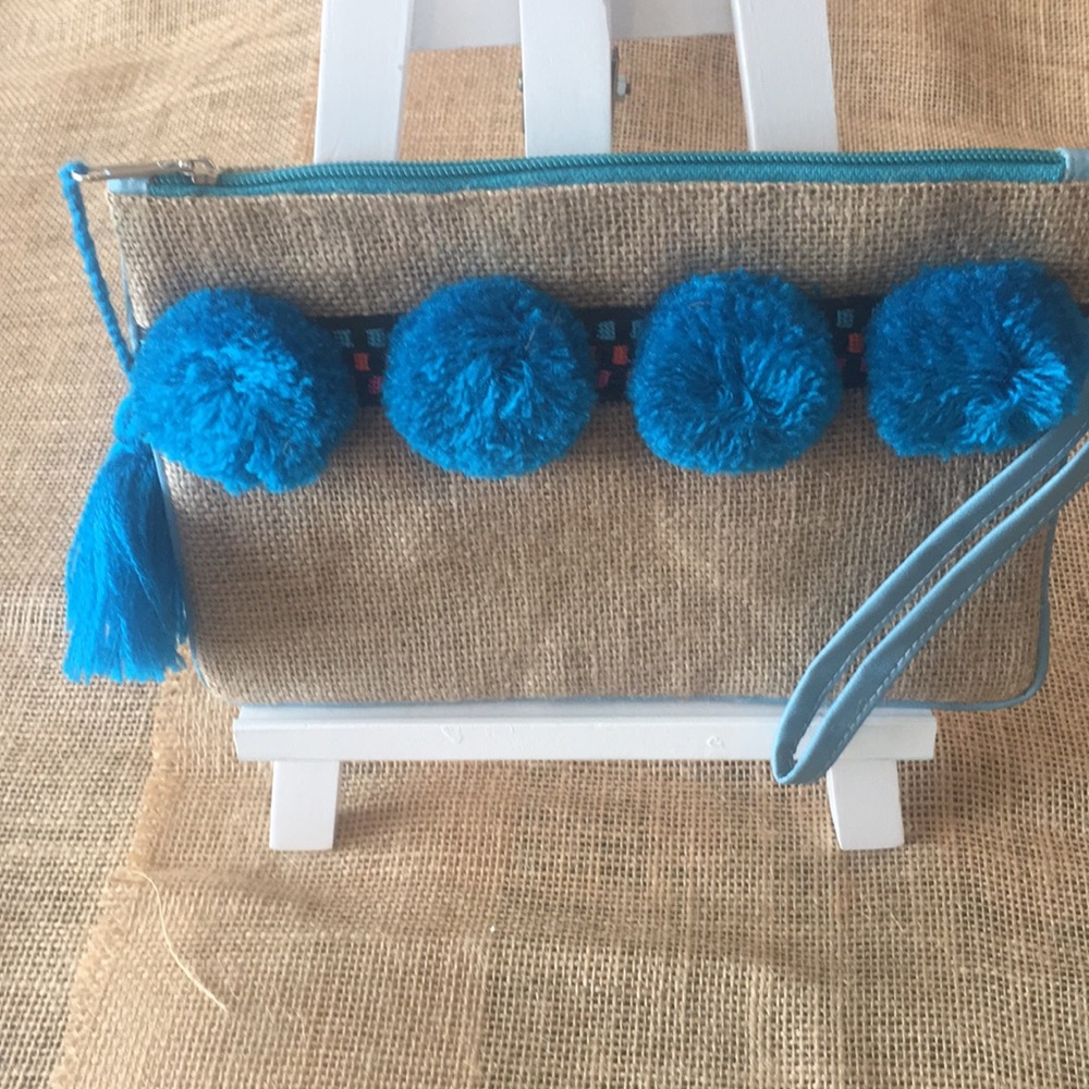 Small clutch with Pompoms